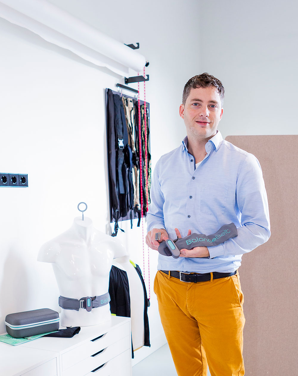 Merijn Klarenbeek, CEO of Elitac Wearables, holding the BalanceBelt. This is a haptic feedback belt for people with balance disorders.