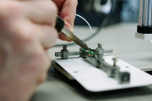 Elitac Wearables company film still - soldering